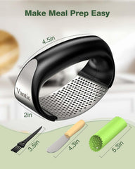 Stainless steel garlic crusher from Tarjah Mart, featuring a durable handle and grinding chamber for efficient garlic mincing.