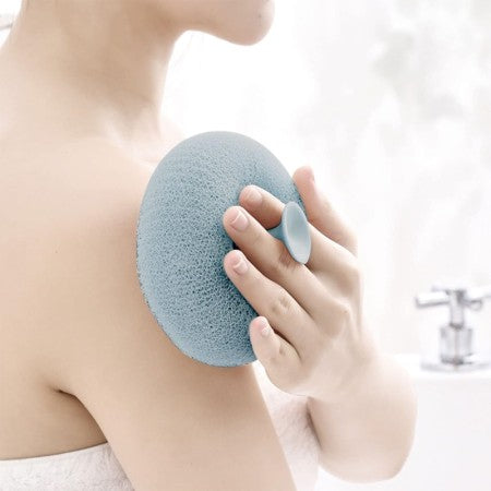 Body scrubber from Tarjah Mart, showing a soft, textured body cleaning tool designed for exfoliating skin.