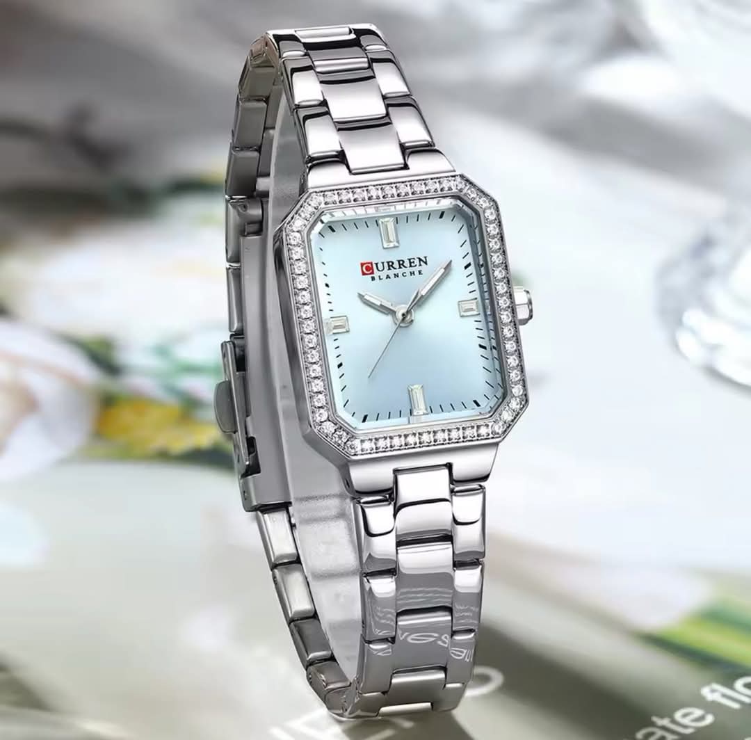 Light blue Curren CUREEN 9102 luxury women's waterproof quartz watch with a sleek design and elegant appearance.