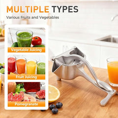 Tarjah Mart manual fruit press juicer extractor with handle for squeezing fresh fruit into juice in a kitchen setting.