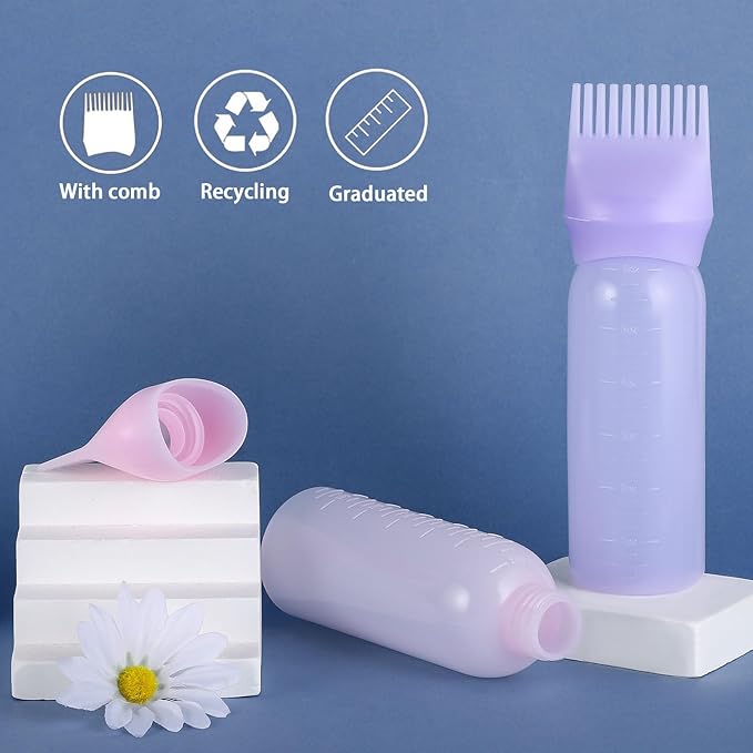 Heir oil bottle by Tarjah Mart, clear glass container with a black cap, designed for storing cooking or medicinal oils.