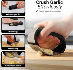 Stainless steel garlic crusher from Tarjah Mart, a kitchen tool with a compact design for easy garlic grinding and crushing.