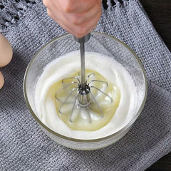 Stainless steel Egg and Coffee Hand Mixer by Tarjah Mart, compact kitchen tool with beaters for mixing eggs or coffee.