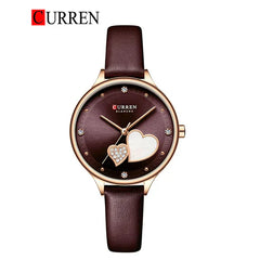 Women’s leather strap watch from Curren 9077 with a sleek round dial and stylish design, perfect for everyday wear.