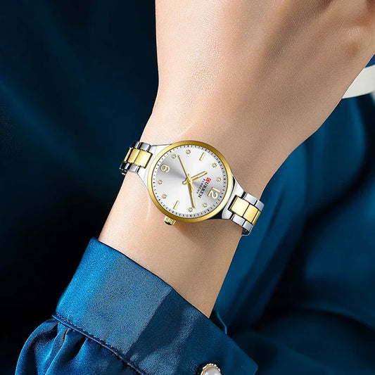 Women's stainless steel watch by Curren, model 9105, featuring a sleek design and silver-tone band.