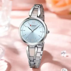 Curren 9092 elegant stainless steel ladies watch with a light blue dial and silver band, showcasing a luxury women's timepiece.