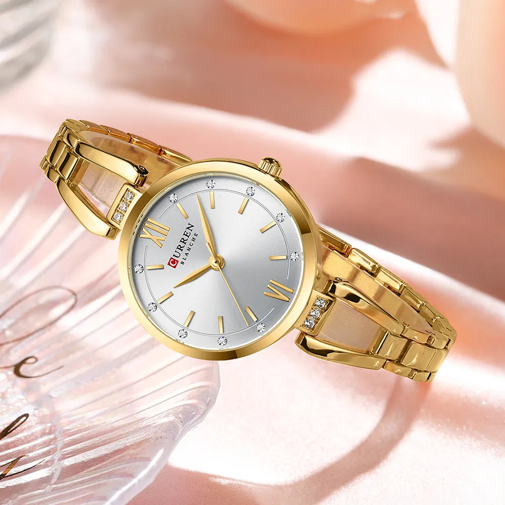 Elegant Curren 9092 ladies' watch with white and gold stainless steel band, featuring a light blue dial for a sophisticated look.