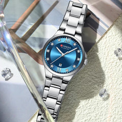 Curren 9107 ladies' quartz fashion watch with white dial and stainless steel band, showcasing elegant luxury design.
