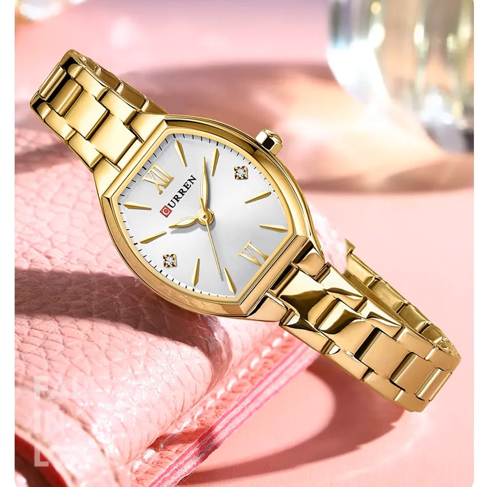 Elegant Curren 9112 women's luxury quartz watch with a silver stainless steel band and white dial, featuring gold accents.
