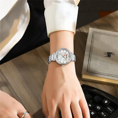 Elegant women's stainless steel watch by Curren featuring a sleek design and classic round dial.