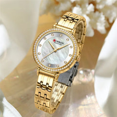 Close-up of Curren 9087 women's stainless steel watch with a sleek silver band and round dial, showcasing elegant watch design.
