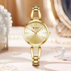 Elegant Curren 9092 ladies' watch with a rose gold stainless steel band and case, showcasing a luxurious and stylish design.