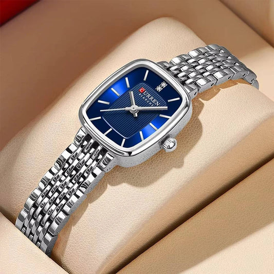 Silver and blue Curren 9093 women's fashion quartz watch with a sleek design and metallic band.
