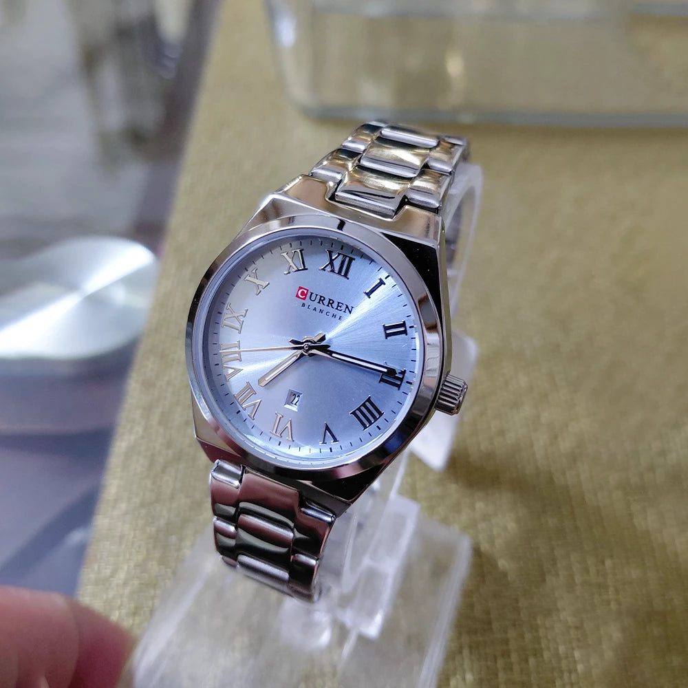 Silver and blue Curren women's stainless steel watch with a sleek design and round dial.