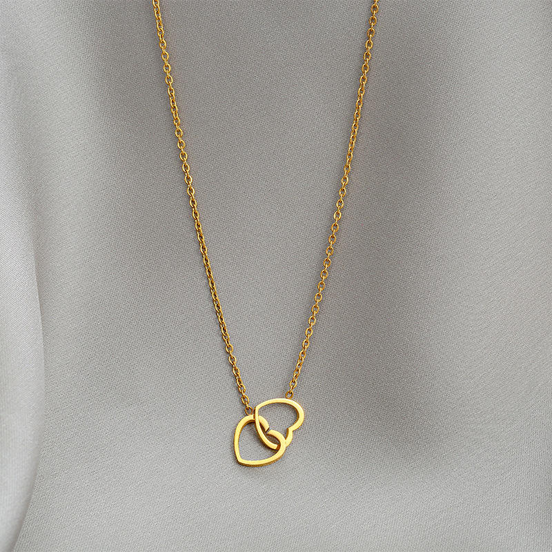 Stainless steel double love necklace by Tarjah Mart featuring intertwined heart pendants on a delicate chain.