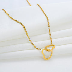 Stainless steel double love necklace by Tarjah Mart featuring two intertwined heart pendants on a sleek chain.