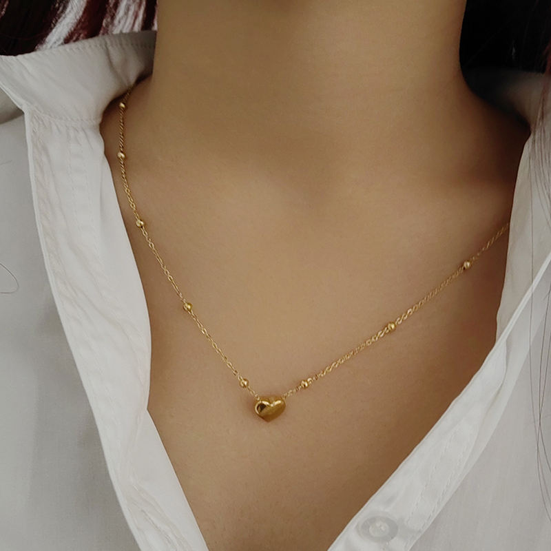 Stainless steel heart necklace by Tarjah Mart featuring a polished, elegant pendant on a delicate chain.