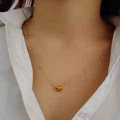 Stainless steel heart necklace by Tarjah Mart featuring a polished, elegant pendant on a delicate chain.