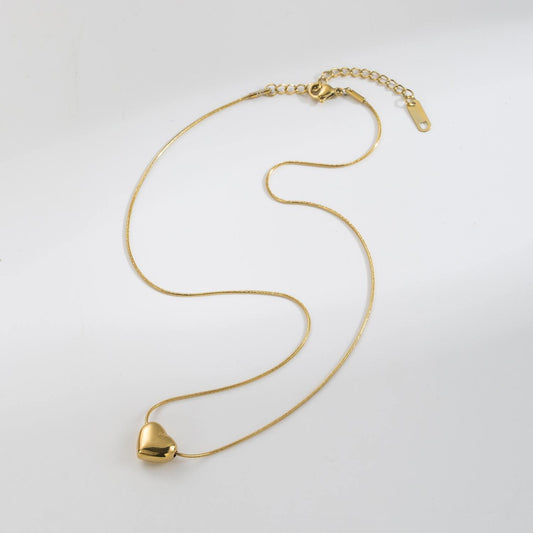 Shiny stainless steel face love necklace from Tarjah Mart with a sleek, polished design and a heart-shaped pendant.