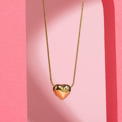 Shiny stainless steel face love necklace by Tarjah Mart featuring a sleek, modern design with a heart-shaped pendant.