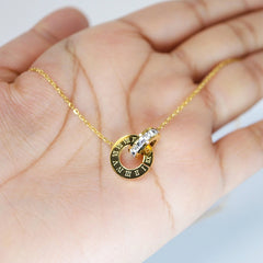 Gold Roman double ring necklace by Tarjah Mart featuring layered circular pendant design