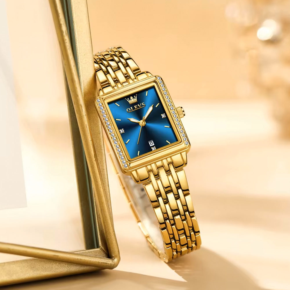 Blue OLEVS 9995 women's elegant quartz watch with a sleek round dial and stylish design.