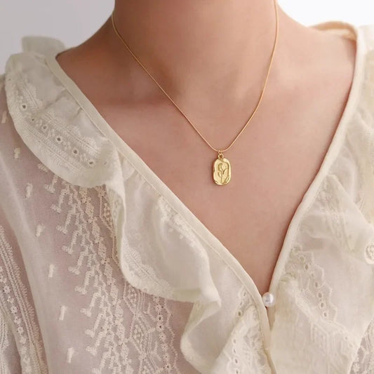 Vintage geometric rose pendant necklace by Tarjah Mart featuring a simple, elegant floral design on a delicate chain.