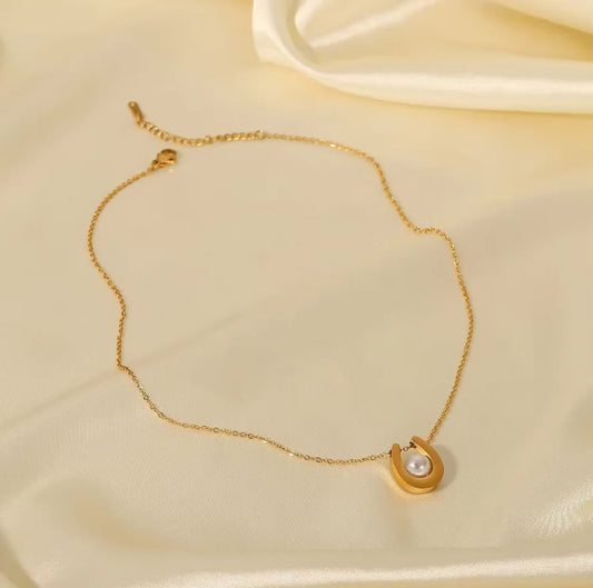 Gold plated stainless steel U-shaped pearl pendant necklace with round pearls, stylish jewelry by Tarjah Mart.