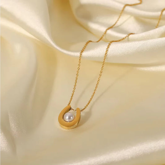 Gold plated stainless steel U-shaped pearl round pendant necklace featuring a sleek, elegant design with a polished finish.