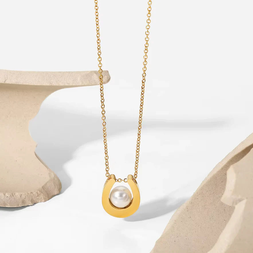 Gold plated stainless steel U-shaped pearl round pendant necklace by Tarjah Mart, featuring a sleek U-shaped design with round pearls.