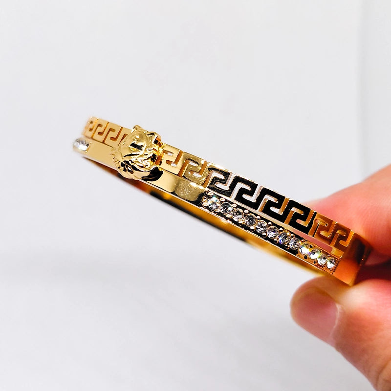 Stainless steel women's bracelet with sleek design, by Tarjah Mart, shown in a close-up view highlighting the polished metal finish.