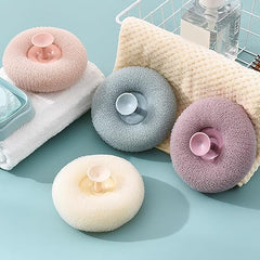 Body scrubber from Tarjah Mart, single piece, textured exfoliating body scrubber for skincare, shown in close-up image.