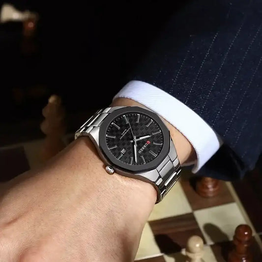 Silver and black Curren men's quartz watch with a sleek design, featuring a round dial and metal strap.